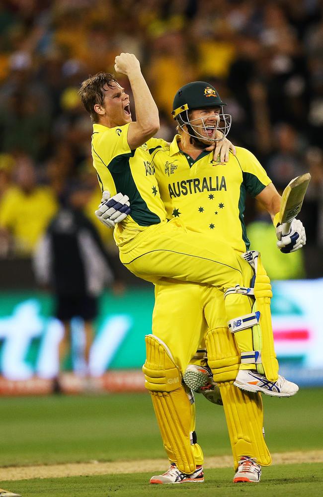 Steve Smith and Shane Watson celebrate after hitting the winning runs during the 2015 ICC Cricket World Cup Final between Australian and New Zealand at the MCG. Picture: Phil Hillyard