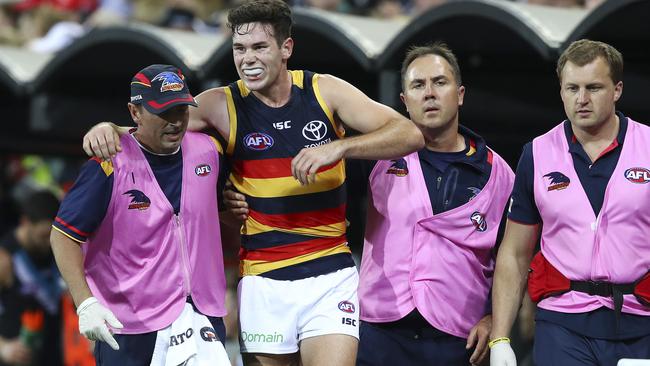 Mitch McGovern is helped from the ground. Picture: Sarah Reed