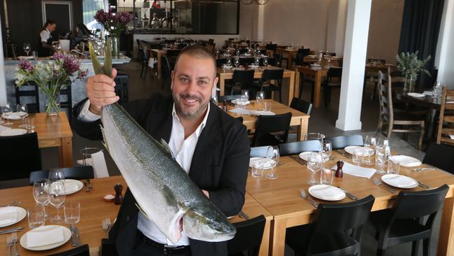 Owner Simon Gloftis at the new Hellenika at Nobbys Beach. Picture Glenn Hampson