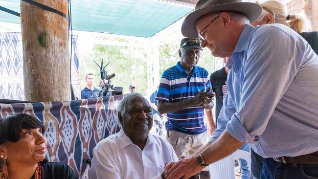 Galarrwuy Yunupingu AM interacts with Australian Prime Minister Anthony Albanese during the Garma Festival at Gulkula. Picture: Tamati Smith/Getty Images