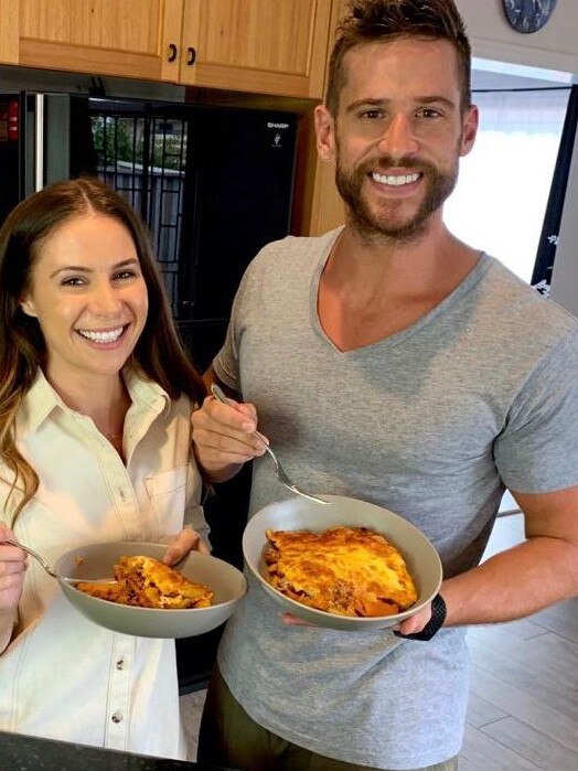 Dan Ewing and his partner Kat enjoying a meal during lockdown.