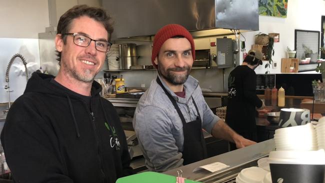 Co-owners of the Cactus Cafe on Old Pittwater Rd, Brookvale, Cedric le Page (left) and Manu Marsan, on Tuesday. They have set up their own takeaway delivery service instead of using the big delivery platforms like DoorDash and uber eats. Picture: Jim O’Rourke