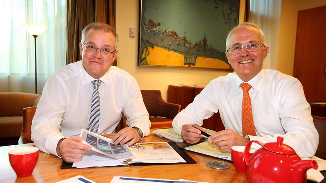 Treasurer Scott Morrison and Prime Minister Malcolm Turnbull looking over Budget papers in the Prime Minister’s office, at Parliament House in Canberra. Picture: Kym Smith