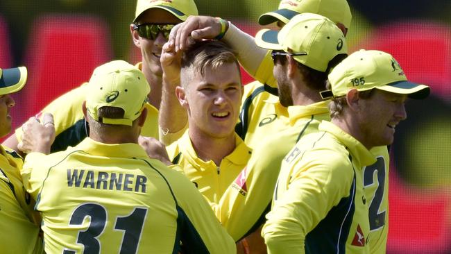 Adam Zampa (C) of Australia celebrates with teammate after dismissing Kane Williamson.