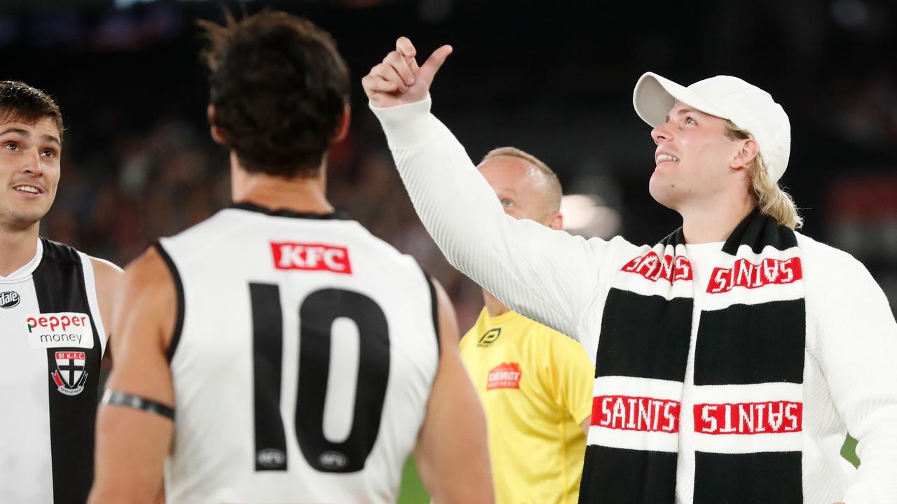 Jackson Warne tosses the coin before the St Kilda v Collingwood match. Picture: Michael Willson
