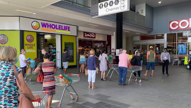 Long lines are starting to build outside Coles Newmarket as supermarkets prepare for a busy afternoon.