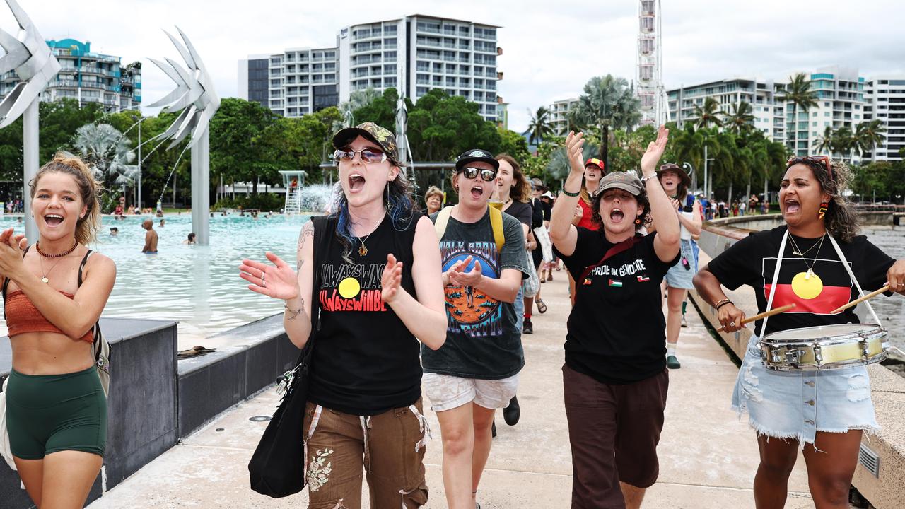 Jaye Brown, Erin Stone, Mel Withers, Monique Jeffs and Talicia Minniecon march together in the Invasion Day rally and protest, held first in Fogarty Park and then along the Esplanade on Australia Day. Picture: Brendan Radke