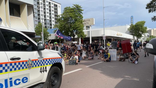 Protesters try to block police cars on Mitchell St. Picture: Thomas Morgan