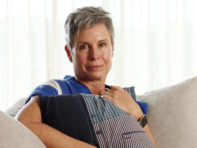 Pauline McGrath embraces a pillow made from her late husbands shirts, her husband died from voluntary assisted dying, West End. Picture: Liam Kidston