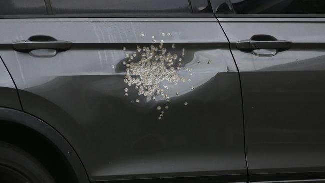 A view of the car in the driveway owned by the residents which was shot during a home invasion early this morning. Picture: NewsWire