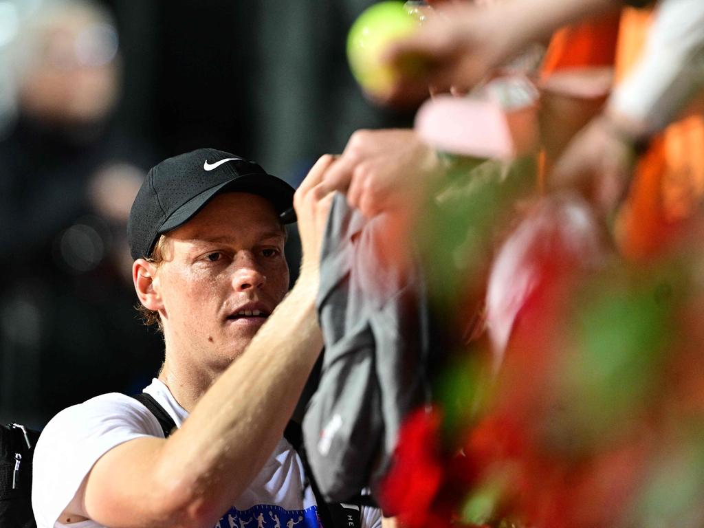 Italy's Jannik Sinner signs autographs as he leaves the court after a training session ahead of the Italian Open. Picture: AFP