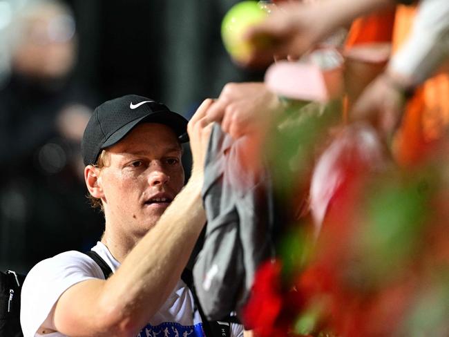 Italy's Jannik Sinner signs autographs as he leaves the court after a training session ahead of the Italian Open. Picture: AFP