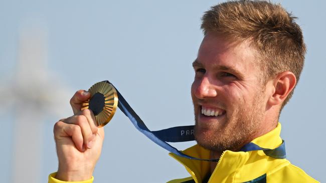 MARSEILLE, FRANCE - AUGUST 07: Matt Wearn of Team Australia celebrates at the medal ceremony after winning the Gold medal in the Men's Dinghy ILCA class on day twelve of the Olympic Games Paris 2024 at Marseille Marina on August 07, 2024 in Marseille, France. (Photo by Clive Mason/Getty Images)