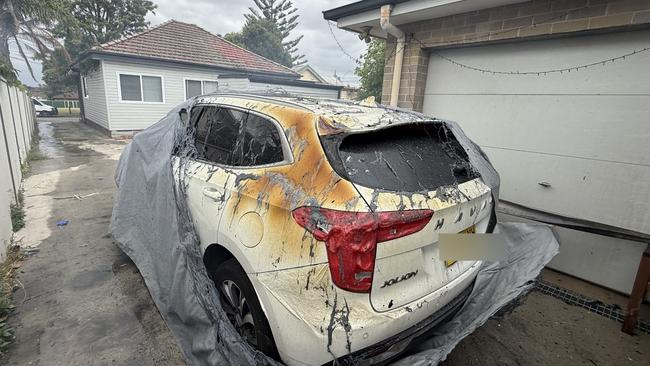 One of two cars destroyed in the blaze. Picture: Fire and Rescue NSW