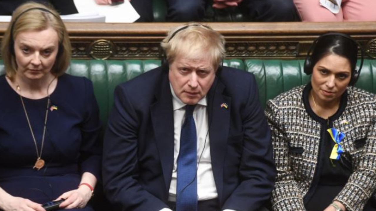 UK PM Boris Johnson listens to Ukraine's president.