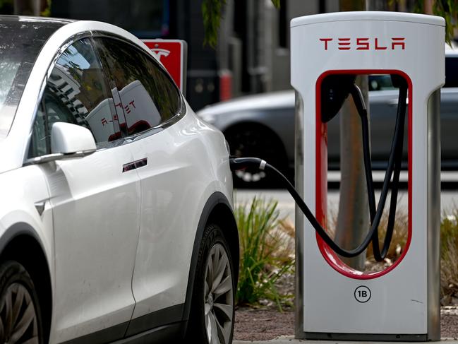 ADELAIDE, AUSTRALIA - NewsWire Photos October 20, 2022: Generic photos of electric cars and charging stations. Tesla charging station at the Franklin Street bus station.Debate over repeal of electric vehicle levy to continue/ conclude in SA lower house. The tax forces electric vehicle owners to pay a 2.5 cent per kilometre mileage charge on zero-emission vehicles in lieu of the fuel excise not being paid. Axing the tax was an election promise of LaborÃs Peter Malinauskas. Picture: NCA NewsWire / Naomi Jellicoe