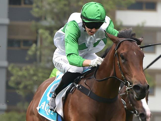 Rookie two-year-old Tony Gollan-trained filly Hi Barbie scores an emotional win at Doomben, with jockey Angela Jones in the saddle. Picture: Grant Peters / Trackside Photography