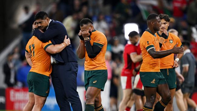 Injured skipper Will Skelton of Australia consoles Blake Schoupp after Australia was thrashed by Wales in the pool stage of the RWC in Lyon. Picture: Getty Images.