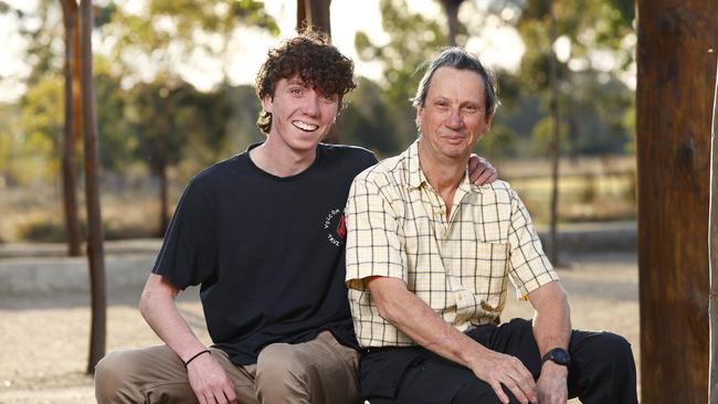 Morgan Gillies, with his dad Denis Gillies, say there's more harmony in the home now that dad Denis has learnt to open up and share his feelings in a men's group. Picture: Richard Dobson