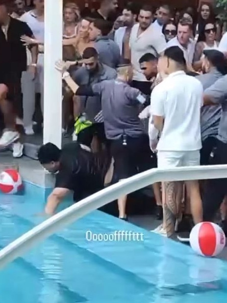 Security helped the man out of the pool after he was pushed backwards. Picture: Facebook