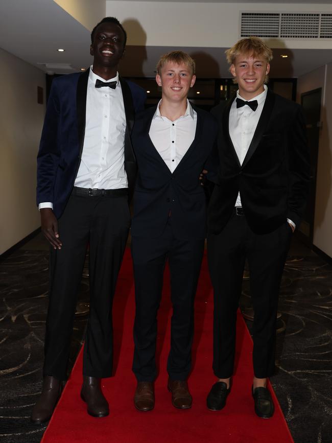 MELBOURNE, AUSTRALIA – JUNE 14 2024 Malual Aleer, Lucas Carter and Alix Tauru attend the Lowanna College Senior Formal 2024 at the Moe Racing Club Picture: Brendan Beckett