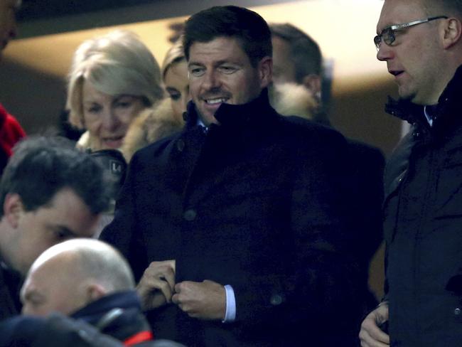 Former Liverpool captain Steven Gerrard, center, takes his seat before the English League Cup semifinal 2nd leg soccer match between Liverpool and Southampton at Anfield stadium in Liverpool, England, Wednesday, Jan. 25, 2017. (AP Photo/Dave Thompson)