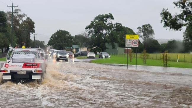 Currently a large volume of water is across two sections of road at Mount Hunter. Picture taken on April 7 by Macarthur region Fire and Rescue NSW.