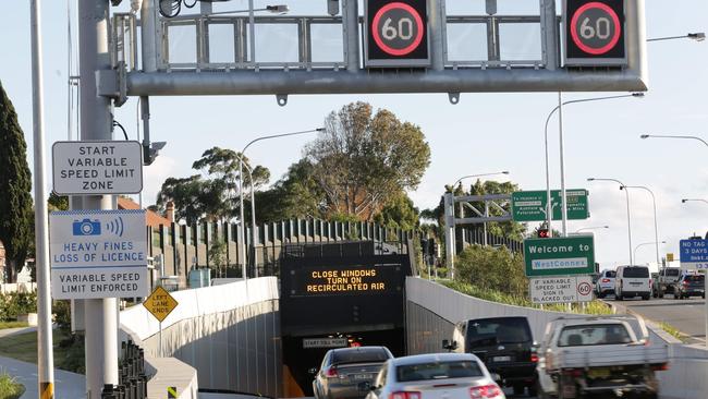 Drivers entering the M4 East Entrance in Croydon pass a speed camera warning sign. Picture: Christian Gilles