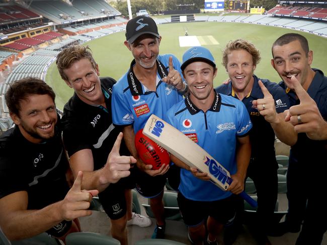 Travis Boak and Tom Jonas of the Port Adelaide Football Club, Jason Gillespie and Travis Head of the Adelaide Strikers and Rory Sloan and Taylor Walker of the Adelaide Crows pose for a photograph to promote a charity Twenty20 cricket match at Adelaide Oval in Adelaide, Friday, January 10, 2020. The Adelaide Crows and Port Adelaide Power football clubs will play a charity T20 cricket match to raise money for bushfire recovery. (AAP Image/Kelly Barnes) NO ARCHIVING