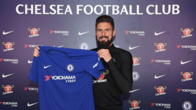 Olivier Giroud is presented with his Chelsea shirt.