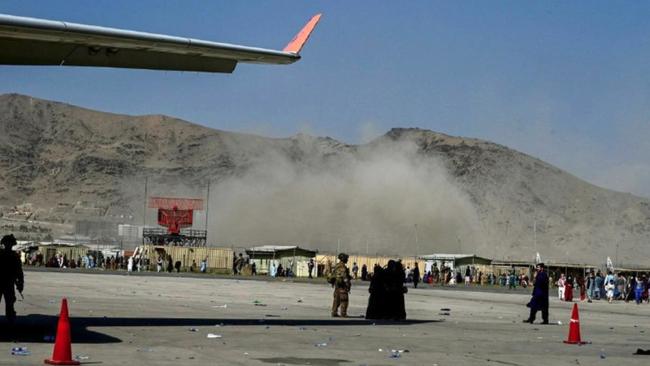 The bomb explodes next to Kabul airport on Thursday.