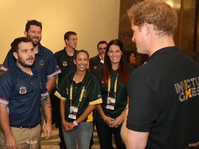 Adrian, left, met Prince Harry at the 2014 Invictus Games in London. Picture: Mark Doran