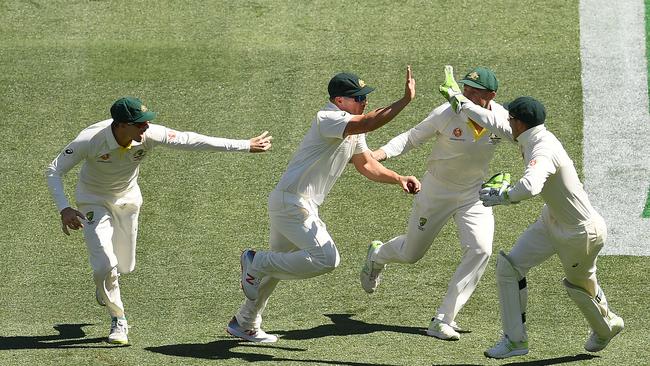 ADELAIDE, AUSTRALIA - DECEMBER 06: Aaron Finch of Australia is congratulated by team mates after taking a catch to dismiss Lokesh Rahul of India during day one of the First Test match in the series between Australia and India at Adelaide Oval on December 06, 2018 in Adelaide, Australia. (Photo by Quinn Rooney/Getty Images)