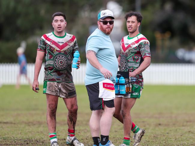 Seagulls trainer out to give Andres Rossini and Tyrese Tuwairua-Brown some water following a South Eastern try. Picture: Adam Wrightson Photography