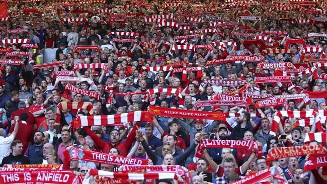 Liverpool supporters cheer prior to the English Premier League soccer match between Liverpool and Wolverhampton Wanderers at the Anfield stadium in Liverpool, England, Sunday, May 12, 2019. (AP Photo/Dave Thompson)