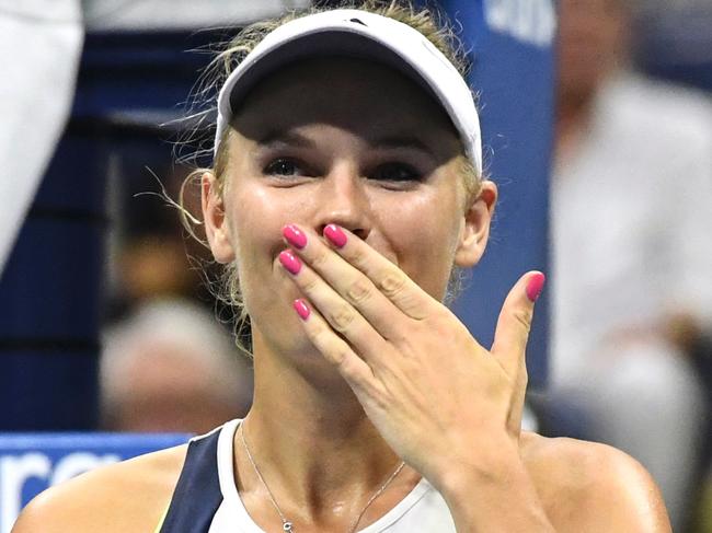 Caroline Wozniacki of Denmark reacts after defeating Anastasija Sevastova of Latvia during their 2016 US Open Women's Singles match at the USTA Billie Jean King National Tennis Center in New York on September 6, 2016. / AFP PHOTO / KENA BETANCUR