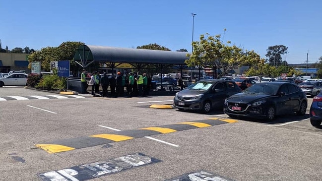 Woolworths staff in the above-ground carpark after their shop was shut when the safety electrical cable was stolen.