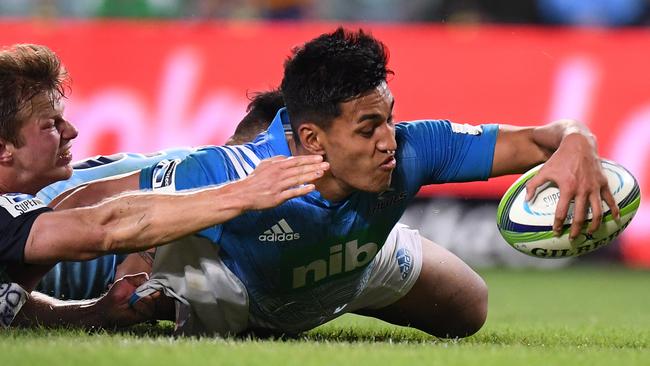 The Blues’ Rieko Ioane scores a try despite the efforts of the Waratahs. Picture: AAP