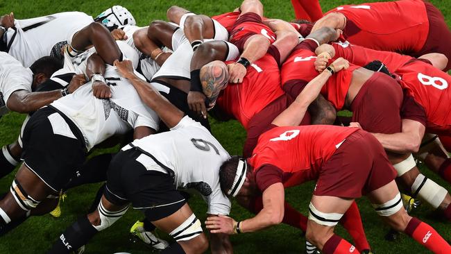 Fiji's and England's players vie in a scrum during a Pool A match of the 2015 Rugby World Cup between England and Fiji at Twickenham stadium in south west London on September 18, 2015. AFP PHOTO / GABRIEL BOUYS RESTRICTED TO EDITORIAL USE, NO USE IN LIVE MATCH TRACKING SERVICES, TO BE USED AS NON-SEQUENTIAL STILLS