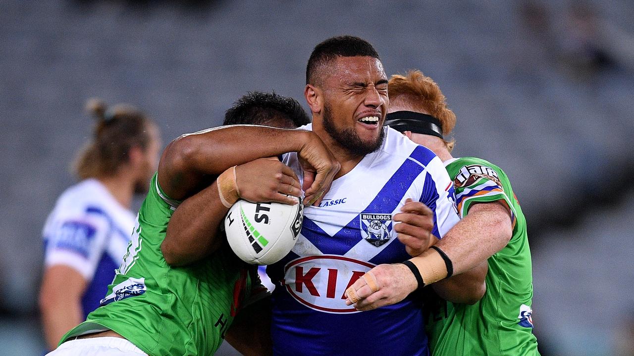Ofahiki Ogden of the Bulldogs is tackled by Dunamis Lui (left) and Corey Horsburgh of the Raiders during the Round 12 NRL match between the Canterbury Bankstown Bulldogs and the Canberra Raiders at ANZ Stadium in Sydney, Saturday, June 1, 2019. (AAP Image/Dan Himbrechts) NO ARCHIVING, EDITORIAL USE ONLY