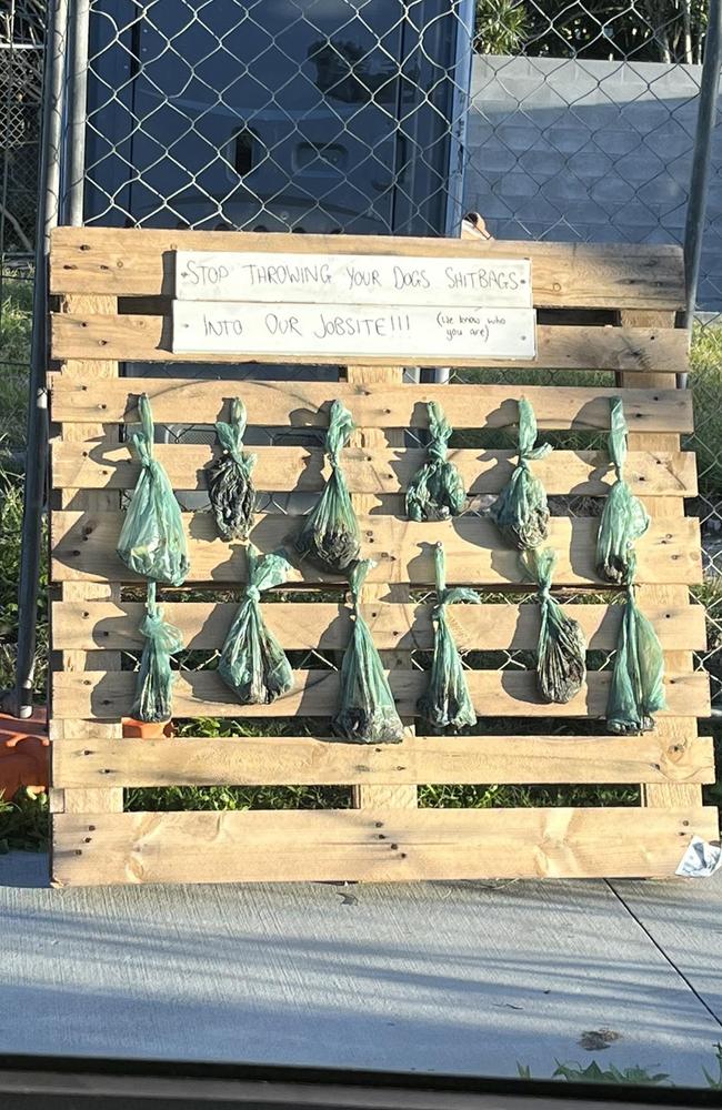 Workers at a Miami job site erect ‘wall of shame’ board for dog walkers leaving poo bags. Photo: Supplied