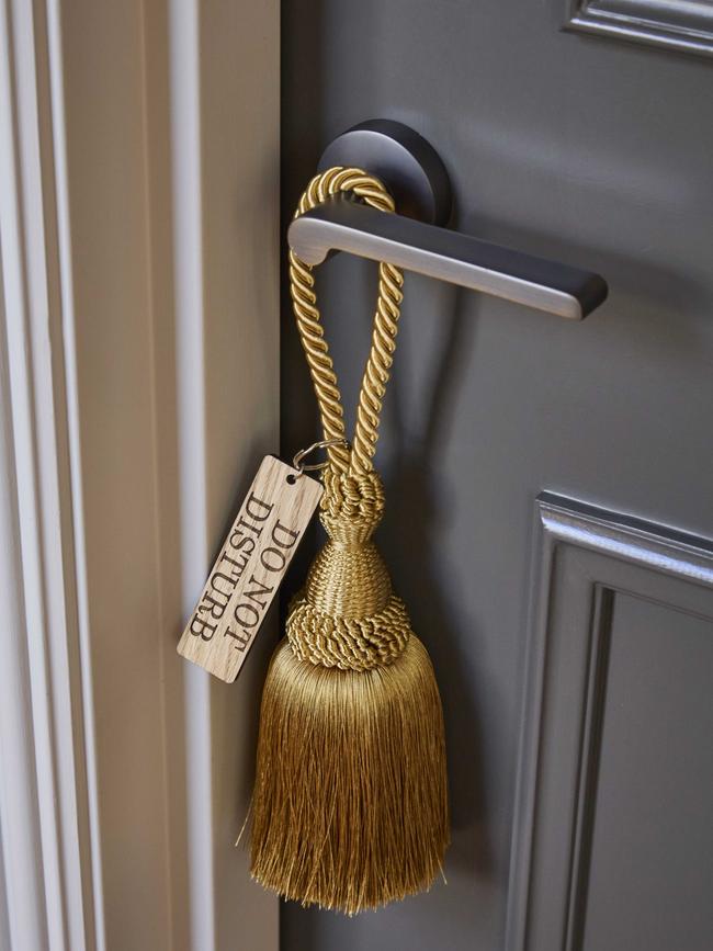 It’s all in the details with this silk tassel privacy sign.