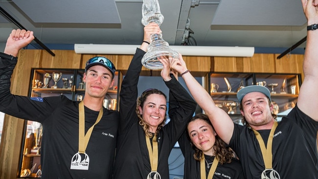 Hobart’s Eddie Reid (left), Paige Caldercoat, of Newcastle, and Eirini Marios and skipper Will Sargent, also of Hobart, with their world championship prize. Picture: Laurens Morel