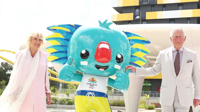 Prince Charles, Prince of Wales and Camilla, Duchess of Cornwall pose with the official mascot Borobi (Photo by Mark Metcalfe/Getty Images)