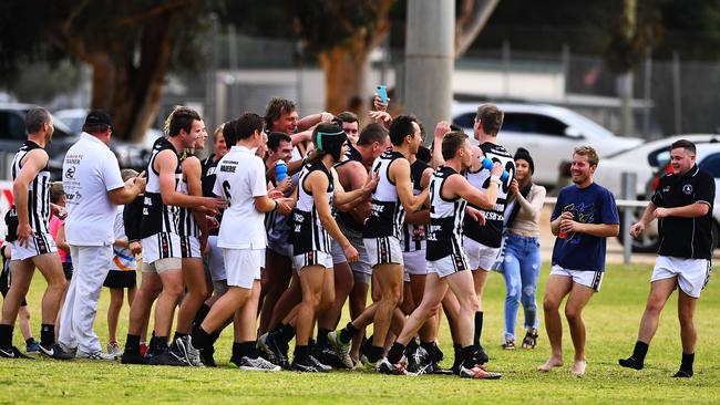 Teammates and fans mob Daniel Nobes after he kicks his 100th goal of the season for Waikerie in the Riverland Football League on Saturday. Picture: Grant Schwartzkopff