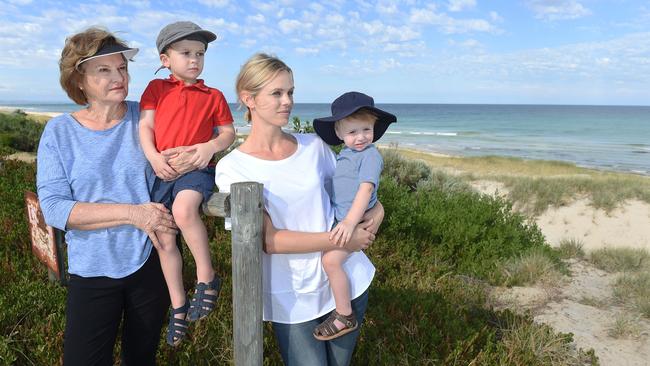 VICTORY: Monique Webber with sons Tennyson, 1, and William, 3, and her mother, Denise Webber, at the Tennyson dunes. <b>Picture: ROGER WYMAN</b>