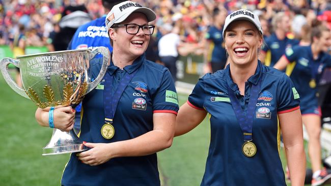 Bec Goddard and forward Abbey Holmes celebrate the premiership win. Picture: Tom Huntley