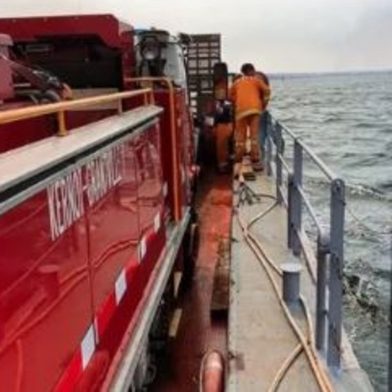 A Kernot-Grantville CFA tanker on board a barge heading to the bushfire at French Island. Image: CFA