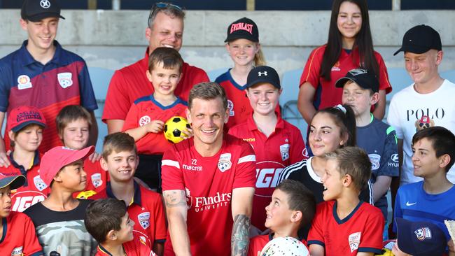 Adelaide United captain Michael Jakobsen with Reds supporters during the club’s open training sessions at Marden Sports Complex. Picture: Tait Schmaal