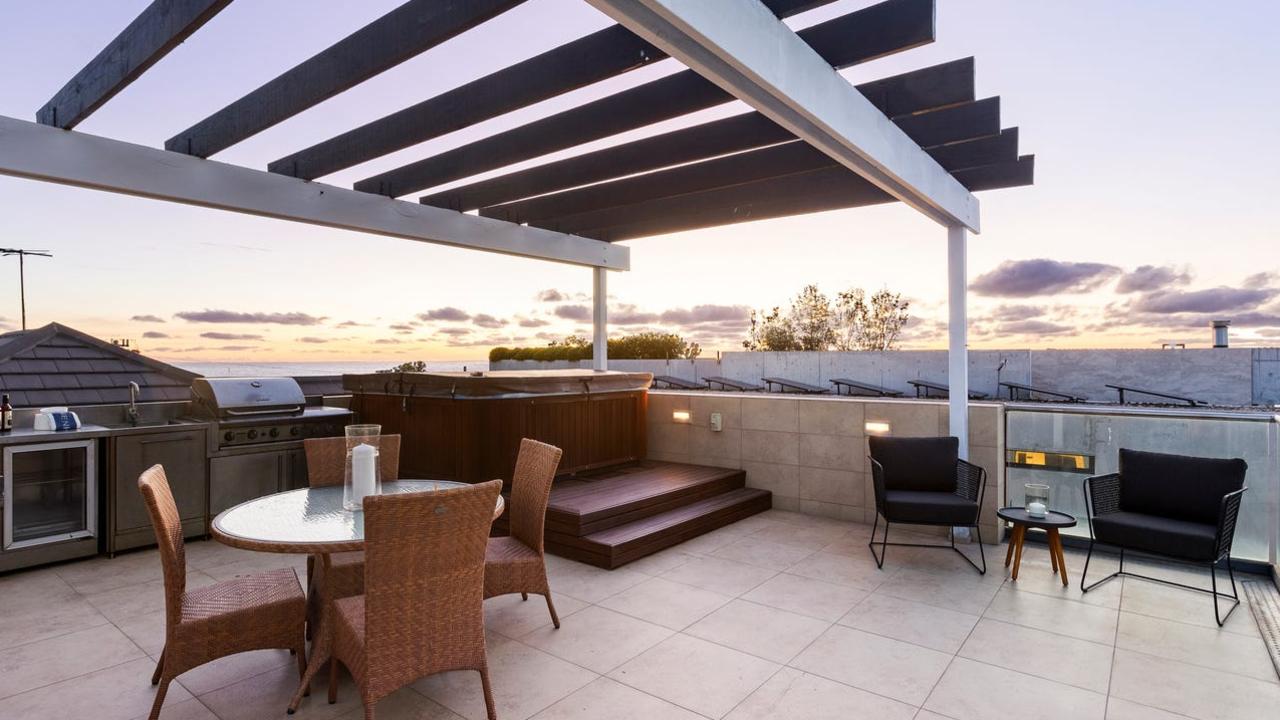 36 Dawson Ave, Brighton, has a schmick rooftop with a hot tub spa and barbecue kitchen.